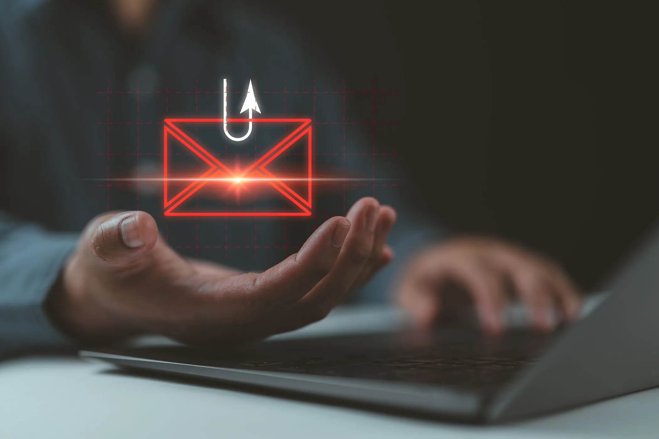 Hình ảnh minh họa tấn công lừa đảo qua email (phishing) với biểu tượng tin nhắn, email và lưỡi câu trên màn hình laptop