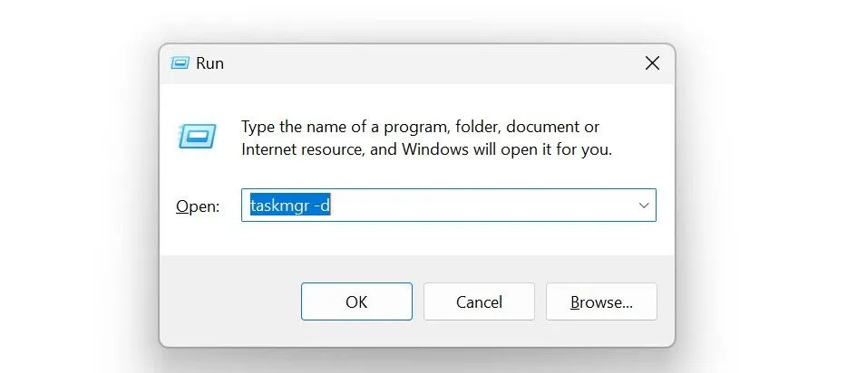 Hộp thoại Run với lệnh &quot;taskmgr -d&quot; để mở Trình quản lý Tác vụ cổ điển trên Windows 11.