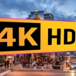 Logo 4K HDR trên màn hình hiển thị cảnh đường phố buổi tối với đèn sáng, minh họa công nghệ dải động cao.