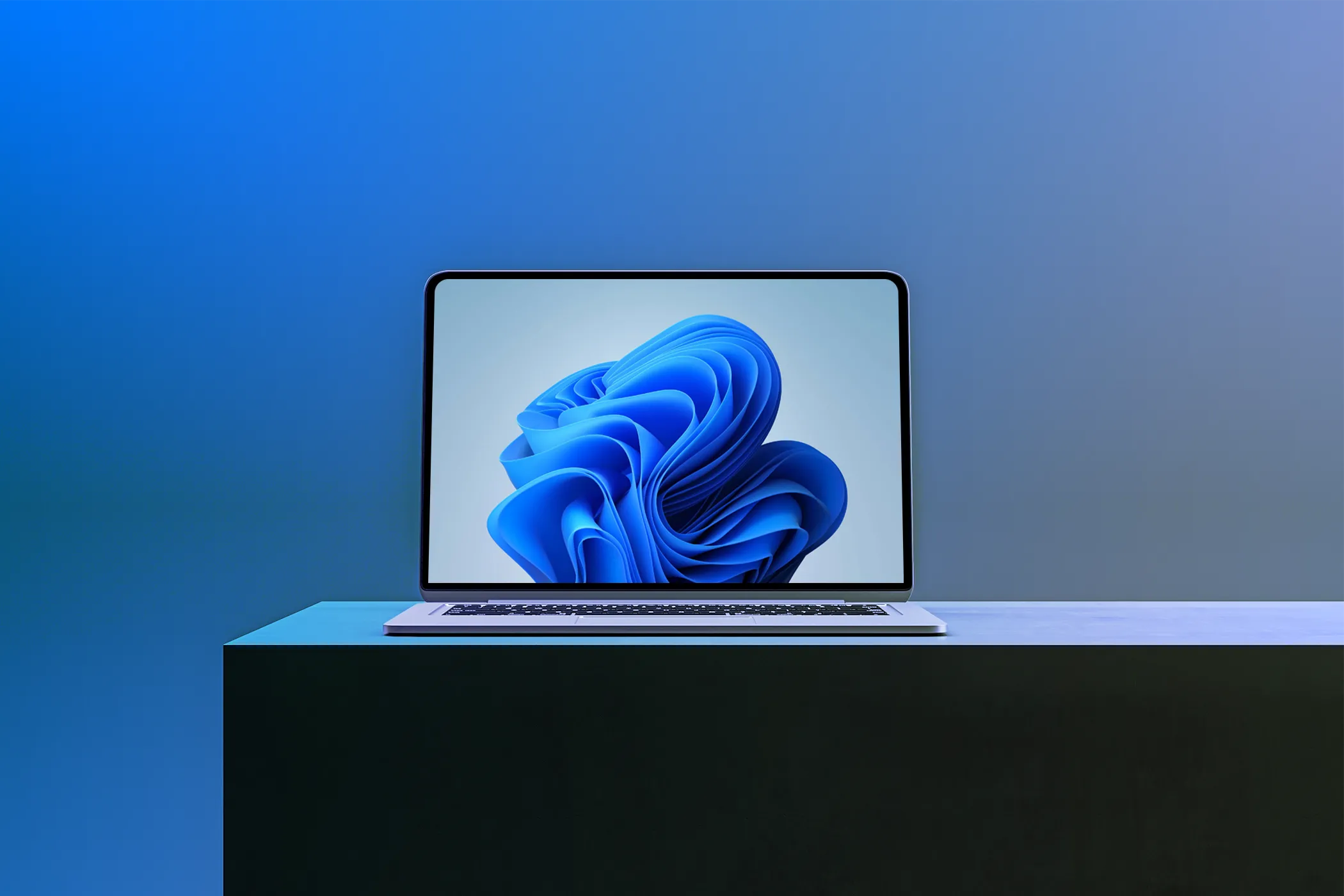 Màn hình laptop hiển thị hình nền Windows 11 với độ phân giải cao, minh họa chất lượng hiển thị sắc nét