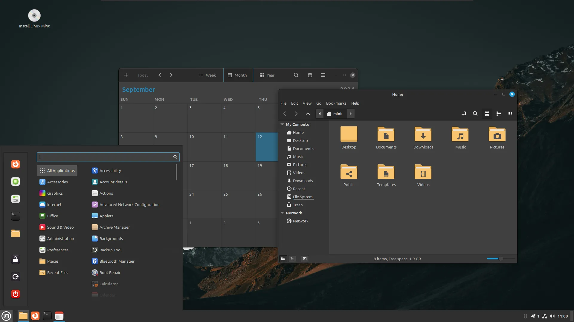 Màn hình nền Linux Mint với ứng dụng lịch và trình duyệt tệp đang mở