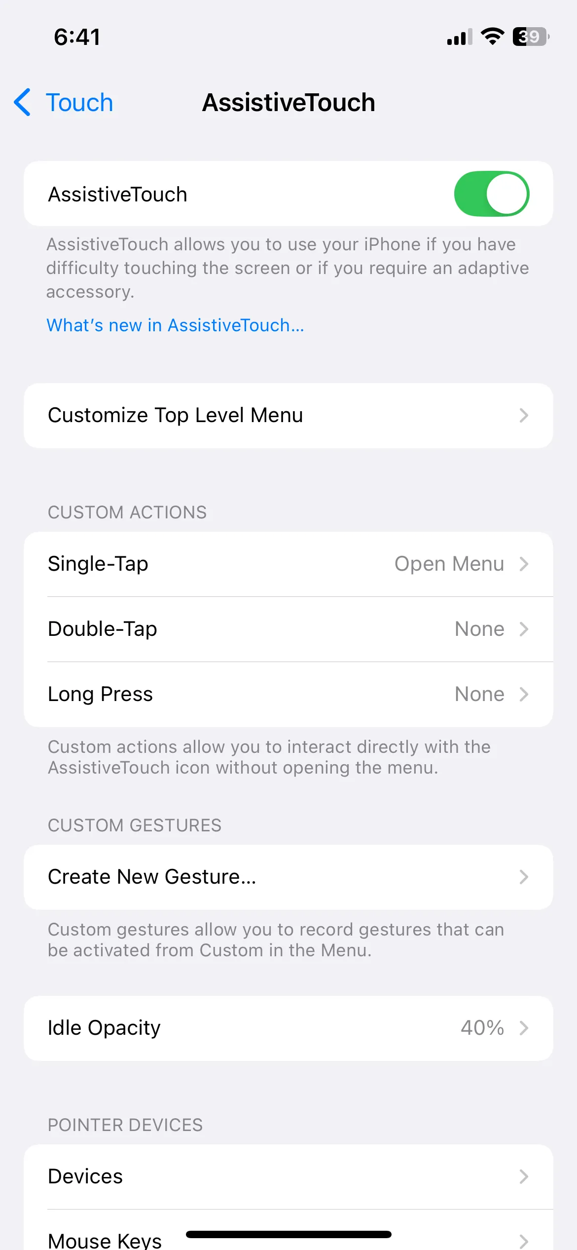 Menu cài đặt AssistiveTouch trên iPhone, hiển thị các tùy chọn trợ năng và tùy chỉnh biểu tượng nổi.