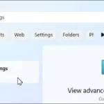 Thanh tìm kiếm Windows 11 hiển thị kết quả "view advanced system settings" để truy cập cài đặt nâng cao.
