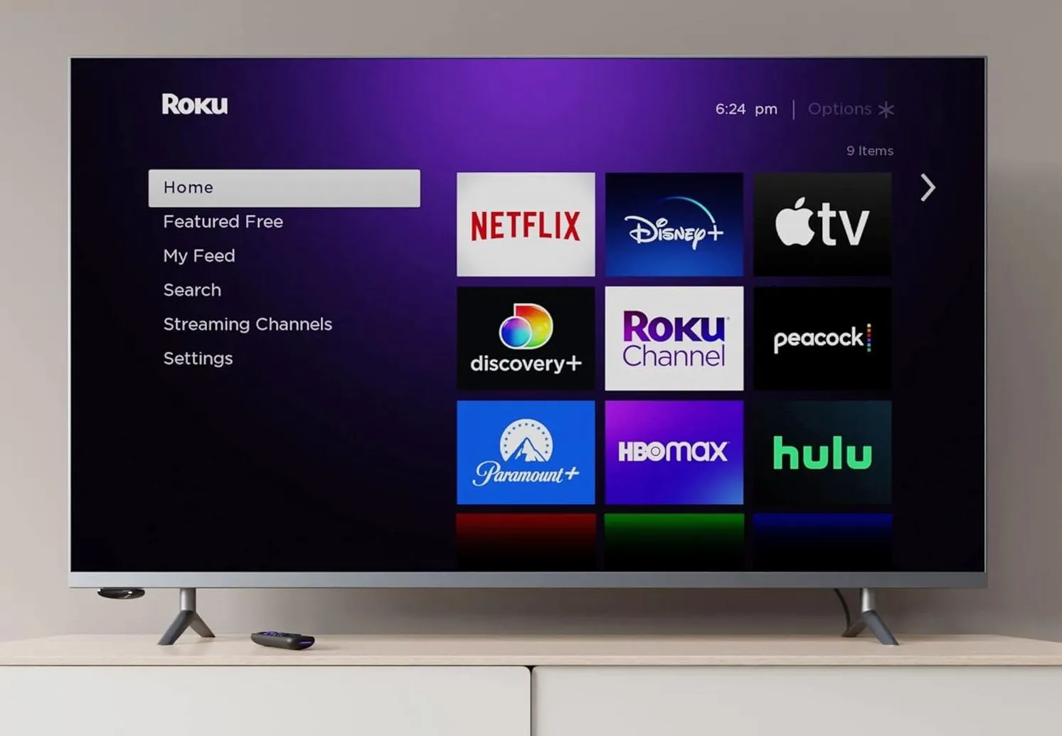 Thiết bị streaming Roku Express nhỏ gọn với cáp HDMI và remote điều khiển, minh họa sự đơn giản trong kết nối TV